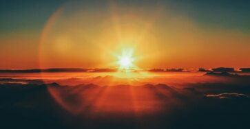 calm body of water during sunset